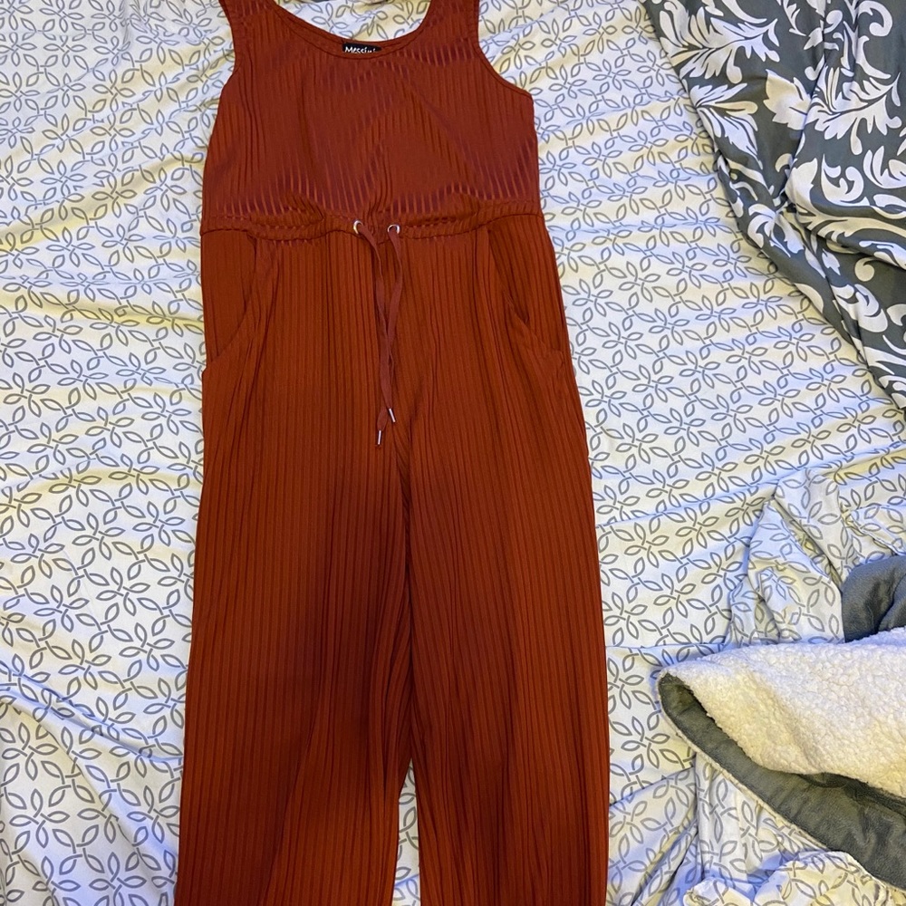 A burnt orange jumper that goes to ankles